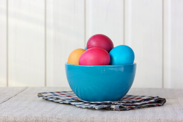 colorful Easter eggs in a bowl on the table