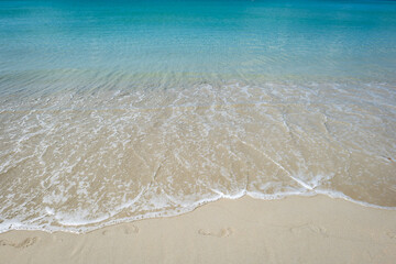 Beach  with clear water with white and golden sand, blue sky, in tropical vacation area. Kata beach in Phuket, Thailand, a photo with copyspace.