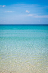 Beach  with clear water with white and golden sand, blue sky, in tropical vacation area. Kata beach in Phuket, Thailand, a photo with copyspace.