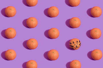 Tangerine pattern on violet background with tiger face drawn on one tangerine. Chinese New Year minimal flat lay visual.