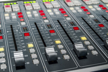 Audio sound mixer in a recording studio.