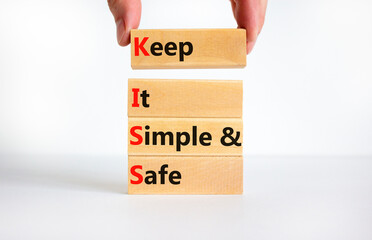 KISS keep it simple and safe symbol. Concept words KISS keep it simple and safe wooden blocks....