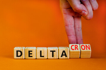Covid-19 delta and deltacron symbol. Doctor turns cubes and changes the word delta to deltacron....