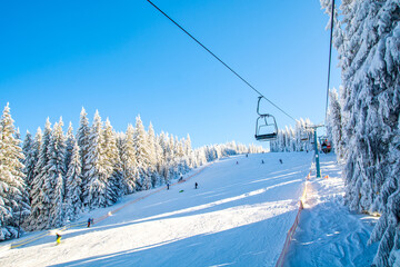 Fototapeta na wymiar Carpathian mountains in winter in Romania, ski resort Paltinis, Sibiu