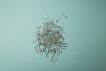 Stationery paper clips on background