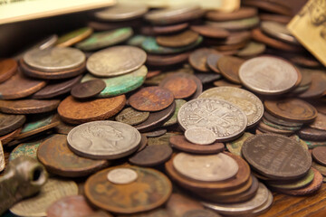 Pile of ancient coins, selective focus