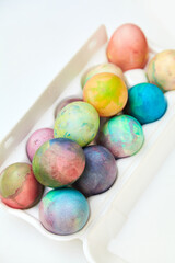 Easter painted eggs folded in plastic container