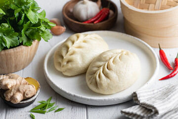 Traditional Korean steamed pie, pyanse or pigodi, on white wooden background, selective focus