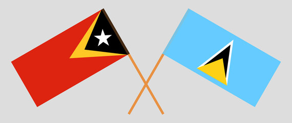 Crossed flags of East Timor and Saint Lucia. Official colors. Correct proportion