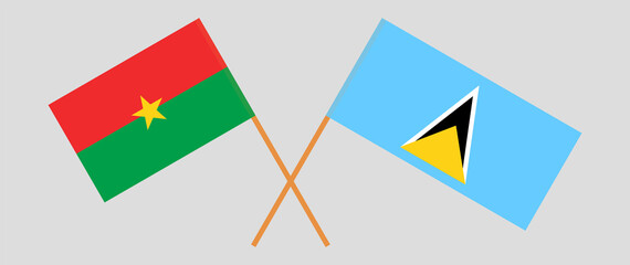 Crossed flags of Burkina Faso and Saint Lucia. Official colors. Correct proportion