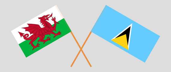 Crossed flags of Wales and Saint Lucia. Official colors. Correct proportion