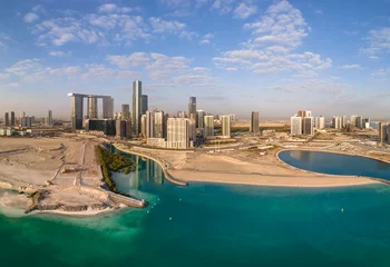 Zelfklevend Fotobehang Aerial view on developing part of Al Reem island in Abu Dhabi on a cloudy day © Freelancer