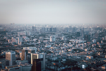 Fototapeta na wymiar Bangkok city skyline top view Downtown and business office bank financial in capital city of Thailand that showing smog and polluted air pollution from particle PM2.5.