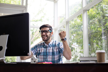 Success working from home of young man.