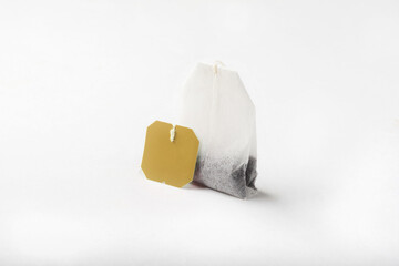 Tea bag on a white background. Tea bag close-up for insulation