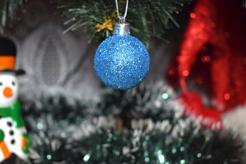 New Year and Christmas, blue ball hanging on the Christmas tree, postcard