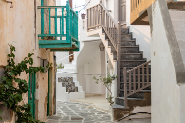 Paros island, Greece. Whitewashed building, empty narrow cobblestone street at Naousa old town