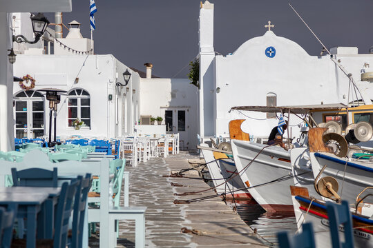 Fishing boat moored at the harbor dock. Greece, Paros island Naousa old port.