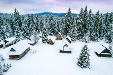 Winter Wonderland with Snow and Wooden Houses in Mountains