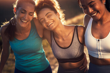 Fototapeta Portrait of three sporty young woman after running outdoors. obraz