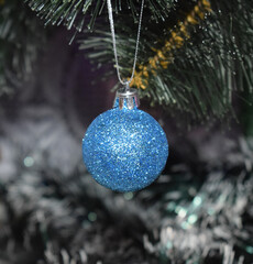 New Year and Christmas, blue ball hanging on the Christmas tree, postcard