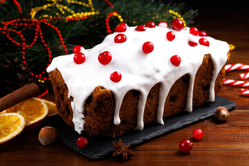 Christmas cake with cranberries. Christmas homebaked. Christmas stollen and Christmas decorations