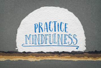 practice mindfulness - inspirational handwriting on a watercolor paper against abstract landscape, mindful lifestyle concept
