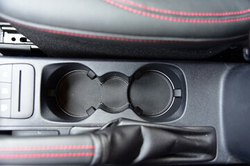 Cup holder between the front seats in the car