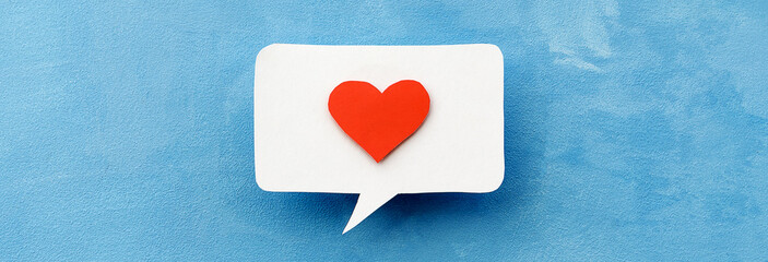  speech bubble with a red heart on a blue background. Space for copying. Positive feedback and feedback.