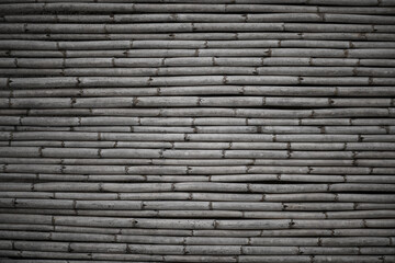 Rustic dry reed fence. Textured background or natural backdrop. Eco tourism concept. Graphic resource for design