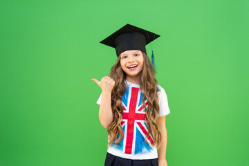 a schoolgirl with an English flag on her T-shirt is very happy and points to an advertisement for...
