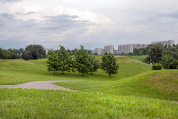 Fototapeta na wymiar Brateevsky Cascade Park on the outskirts of Moscow. Green public space for residents to relax