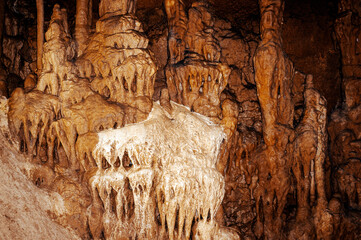 Stalactites and stalagmites in a cave. Beautiful stone texture.