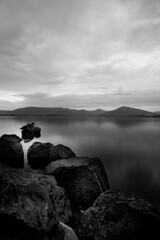A collection of well- placed stones fading into the loch(lake) in Scotland.