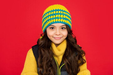 express positive emotion. winter fashion. smiling kid with curly hair in hat. teen girl