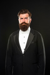 Obraz premium bearded man in tuxedo on black background, formalwear
