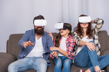 modern life. father mother and child VR glasses. virtual reality family.