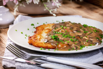 Crispy potato pancakes with mushroom sauce