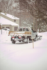 Fototapeta premium Snow truck cleaning the streets during the snow storm