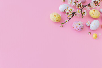 Easter banner. Colorful Easter chocolate eggs and cherry blossoms border on pink background. Happy Easter! Stylish tender spring template. Greeting card
