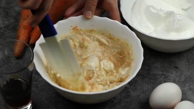 Meringue is added to the dough with grated carrots
