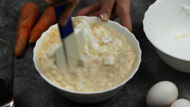 Meringue is added to the dough with grated carrots