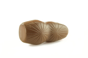 Interesting knocked down statue shape chocolate treat isolated on white background