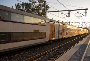 Rail travel. Modern intercity train on a railway platform. Passenger train on the railway in the...