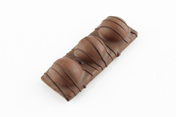Wafer dessert coated with milk chocolate and decorated isolated on white background