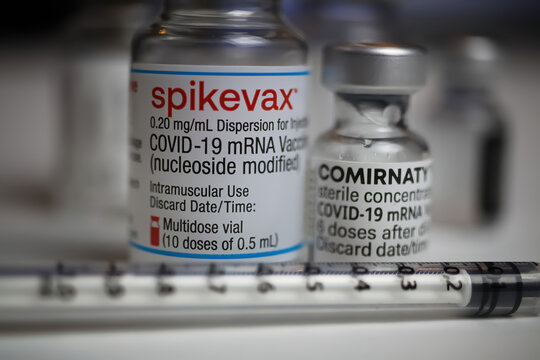 Viersen, Germany - December 9. 2021: Closeup of  biontech pfizer and moderna spikevax mrna covid-19 vaccine vials