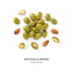 Creative layout made of almonds covered in matcha on the white background. Flat lay. Food concept. Matcha Chocolate Almonds.