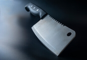 meat ax, kitchen knife on black background, with copy space