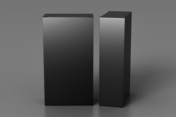 Gift box mock up: two tall and wide black boxes on gray background.  View above.