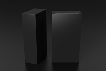 Gift box mock up: two tall and wide black boxes on black background.  View above.